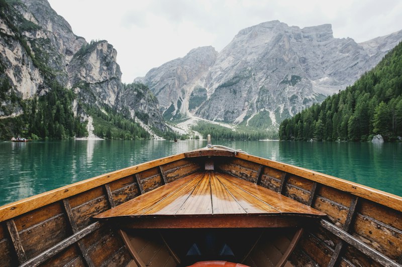 Canoe on still mountain lake